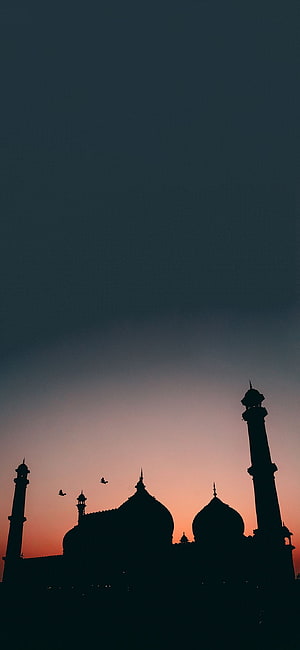 Jama Masjid Silhouette Against a Vibrant Sunset Sky with Minarets and Domes HD phone wallpaper