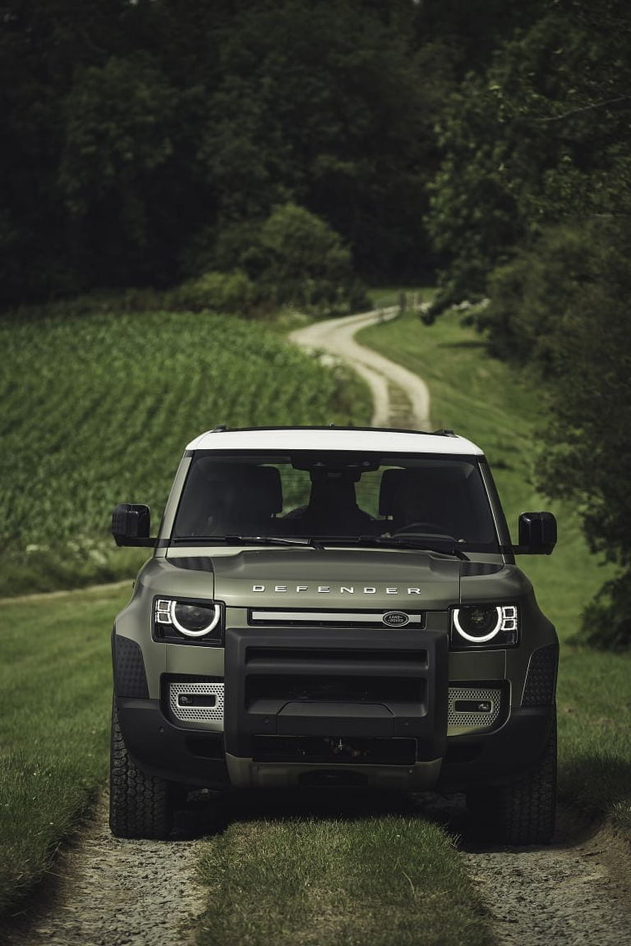 Land Rover Defender 130 V8 Driving on a Rural Dirt Road HD phone wallpaper