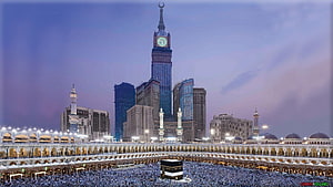 The Kaaba in Mecca Surrounded by Pilgrims with the Abraj Al Bait Clock Tower at Twilight HD wallpaper