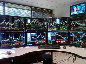 Professional Forex Trading Desk With Multiple Candlestick Chart Monitors HD wallpaper