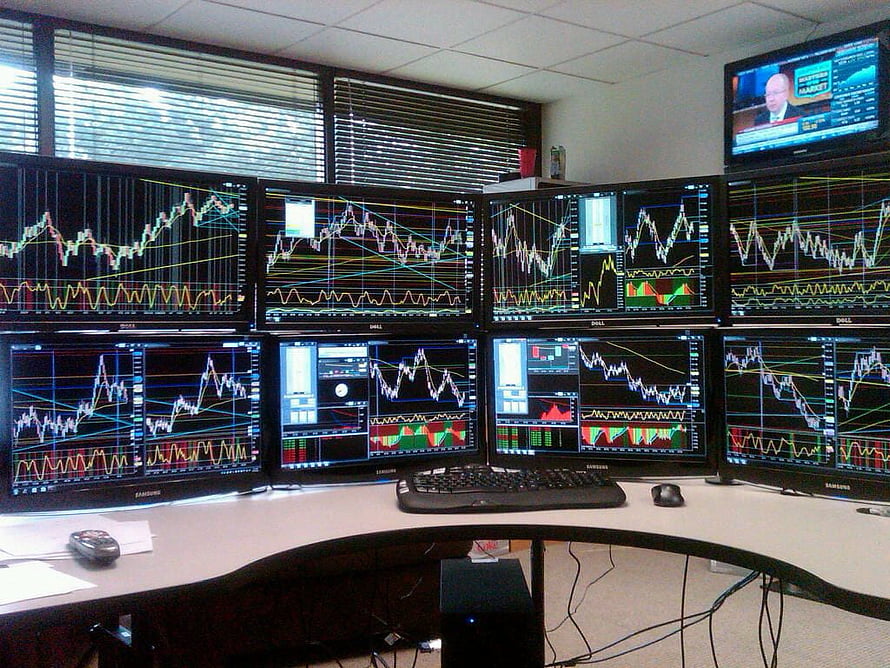Professional Forex Trading Desk With Multiple Candlestick Chart Monitors HD wallpaper