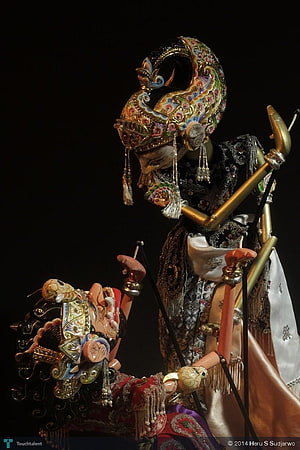 Ornate Wayang Golek Puppets with Intricate Gold Headdresses and Traditional Costumes HD phone wallpaper
