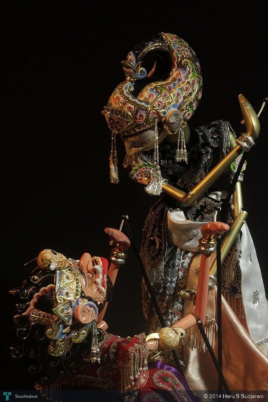 Ornate Wayang Golek Puppets with Intricate Gold Headdresses and Traditional Costumes HD phone wallpaper