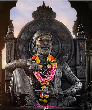 Statue of Chhatrapati Shivaji Maharaj Sitting on Throne with Sword and Flower Garland HD phone wallpaper