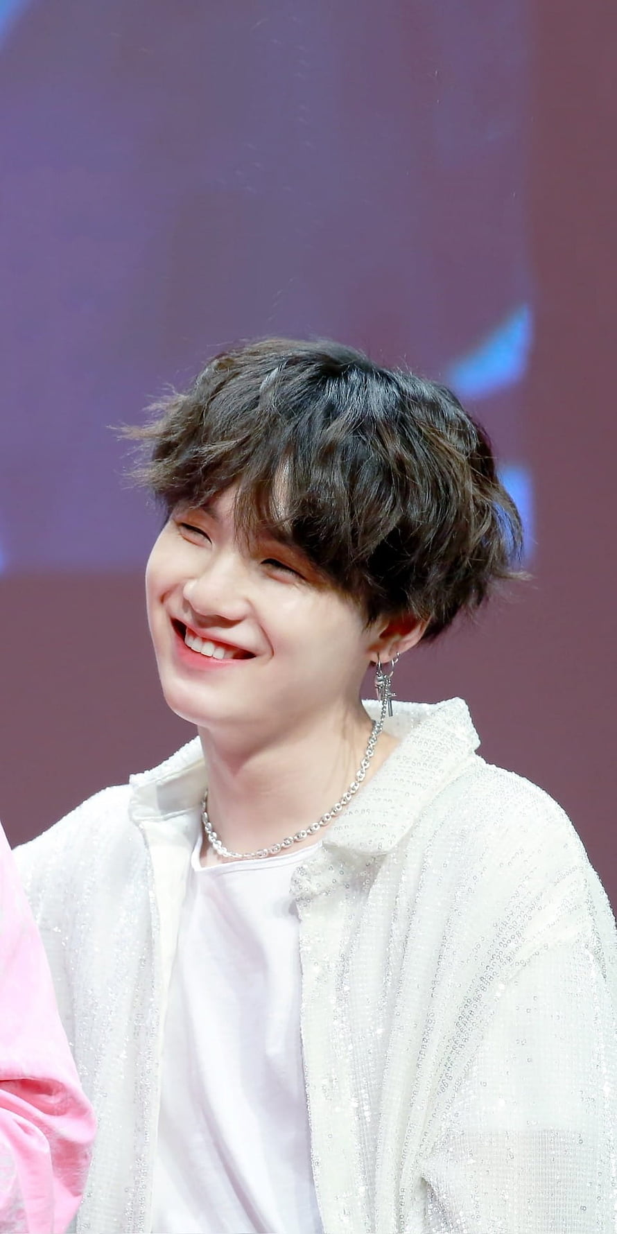 Suga from BTS smiling in a white textured jacket with silver jewelry HD phone wallpaper