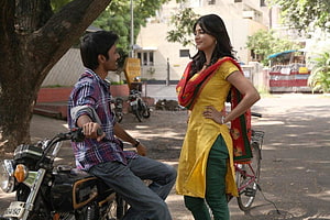 3 Moonu Movie Still: Man on Motorcycle and Woman in Yellow Kurta in Indian Street Scene, Tamil 3 Movie Latest Pics, Stills, 3 moonu movie HD wallpaper