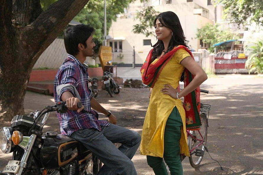 3 Moonu Movie Still: Man on Motorcycle and Woman in Yellow Kurta in Indian Street Scene, Tamil 3 Movie Latest Pics, Stills, 3 moonu movie HD wallpaper