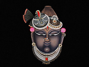 Shrinathji Portrait with Ornate Jewelry and Traditional Headpiece on Black Background HD wallpaper