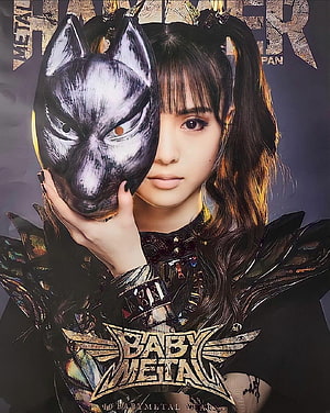 Moa Kikuchi of BABYMETAL holding a metallic wolf mask in dark gothic stage costume HD phone wallpaper