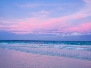 Pastel Pink Beach at Dusk with Soft Waves and Dreamy Sky HD wallpaper