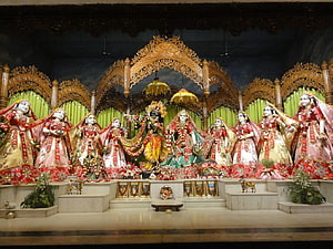 Krishna and the Eight Gopis in Traditional Temple Altar Setting HD wallpaper