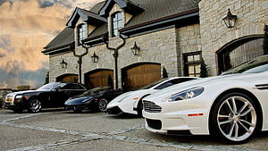 Luxury Supercars Parked in Front of a Grand Stone Mansion HD wallpaper