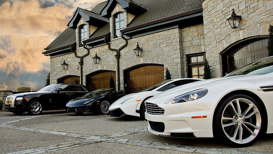 Luxury Supercars Parked in Front of a Grand Stone Mansion HD wallpaper