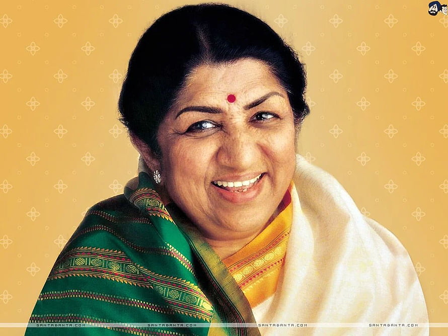 Lata Mangeshkar Portrait in Green and Gold Saree with Warm Smile HD wallpaper
