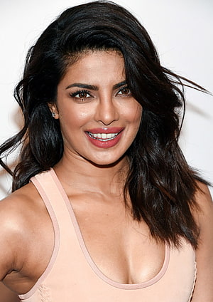 Priyanka Chopra smiling portrait with dark wavy hair and nude tank top HD phone wallpaper