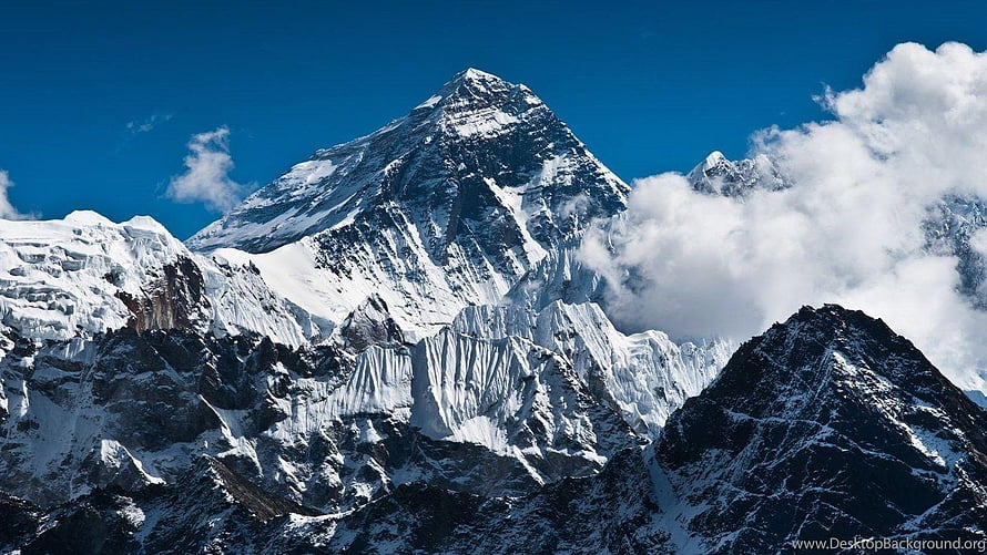 Majestic Mount Everest Peak Rising Above Clouds and Snowy Ridges HD wallpaper