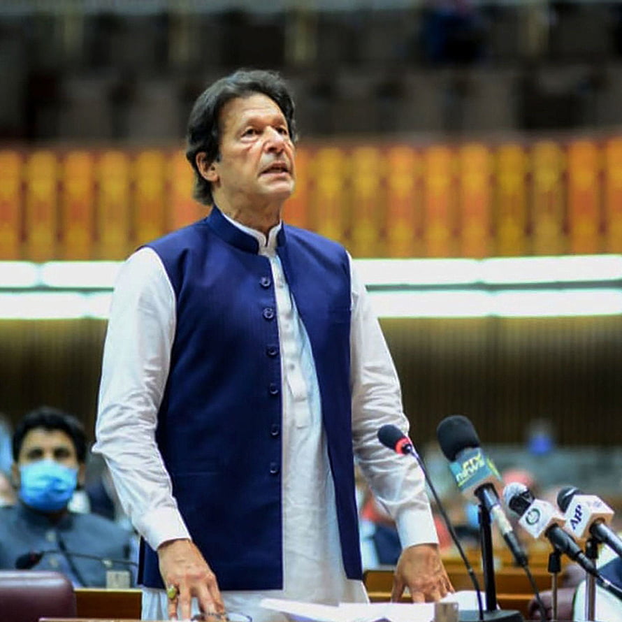 Imran Khan speaking at a podium in the parliament wearing a blue vest HD phone wallpaper