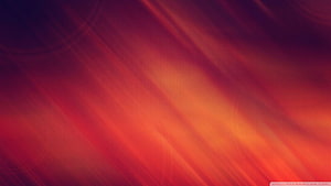Abstract Diagonal Light Streaks in Warm Red and Orange Tones HD wallpaper