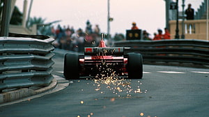 Classic Formula 1 Car Scrape Sparks on Street Circuit HD wallpaper