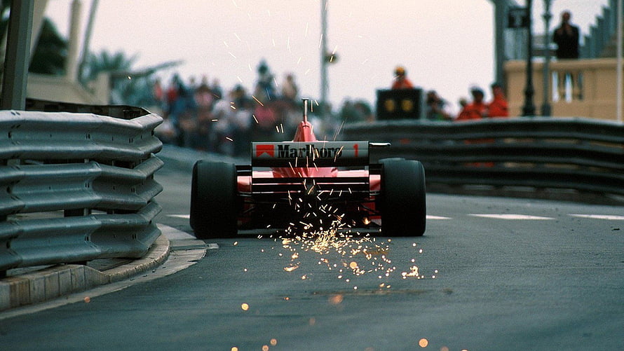 Classic Formula 1 Car Scrape Sparks on Street Circuit HD wallpaper