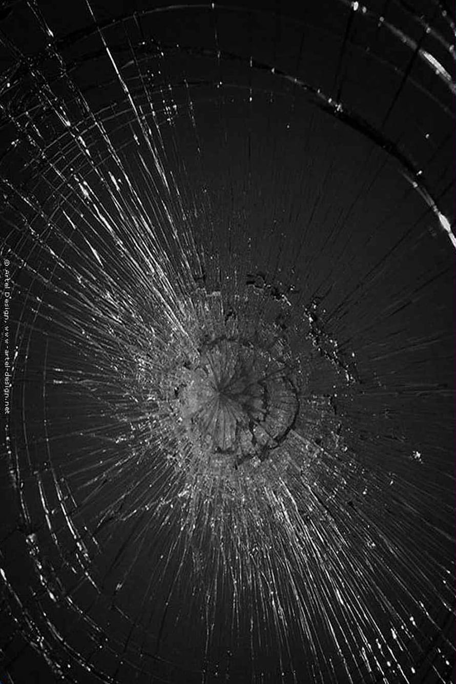 Black Cracked Glass Texture with Radial Fracture Pattern and Central Impact Point HD phone wallpaper