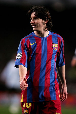 Lionel Messi in Vintage Barcelona Home Kit with Champions League Badge HD phone wallpaper