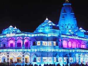 Prem Mandir Temple in Vrindavan Illuminated with Blue and Purple Lights at Night HD wallpaper