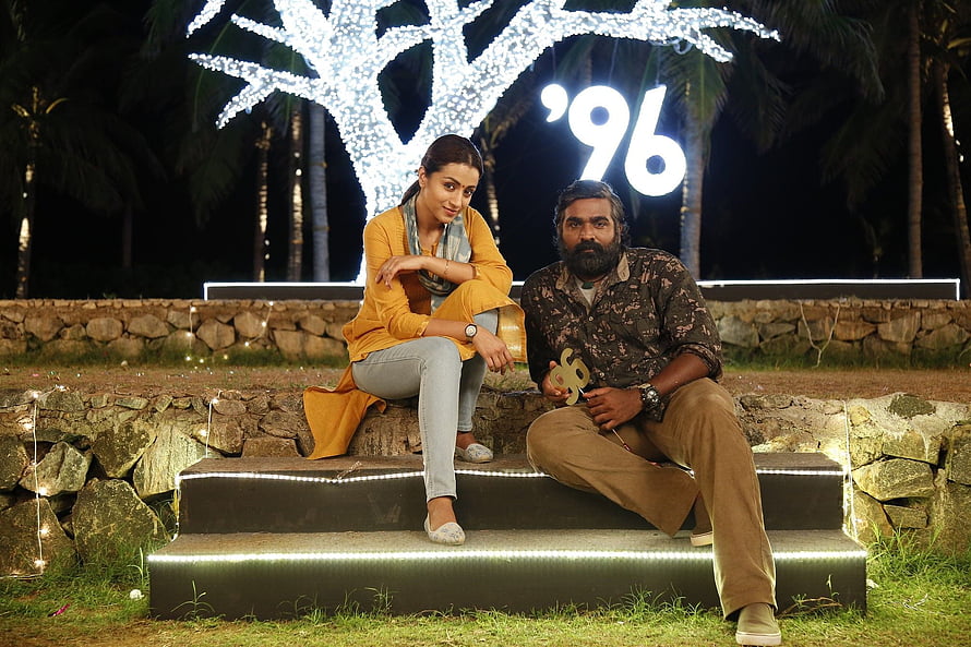 96 Movie Still: Couple Sitting on Illuminated Steps at Night with Glowing Tree HD wallpaper