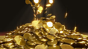 Shimmering Pile of Gold Coins with Falling Currency Against a Dark Background HD wallpaper