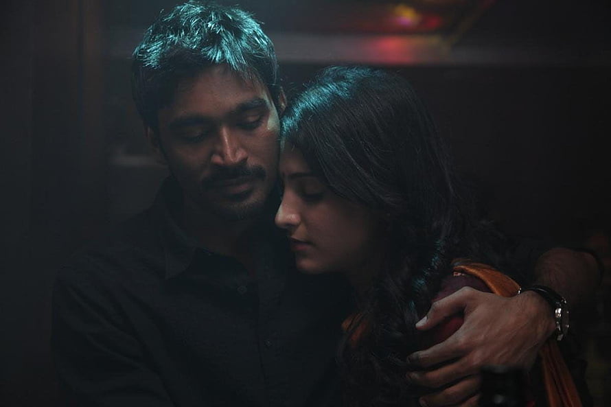 Dhanush and Sai Pallavi in an intimate embrace from the movie Maari 2, cinematic dark lighting HD wallpaper
