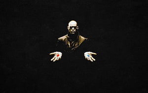 Morpheus from The Matrix holding the red and blue pills in a dark cinematic scene HD wallpaper