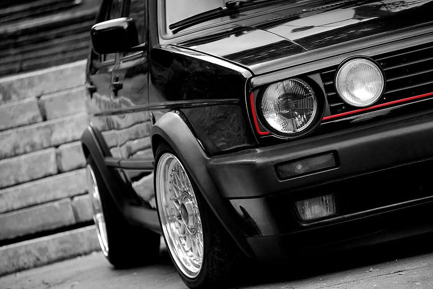 Black Volkswagen Golf Mk2 GTI with Red Accent Line and Chrome Rims HD wallpaper