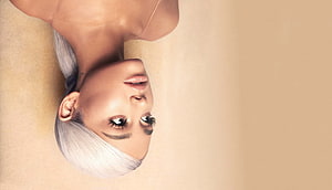 Ariana Grande Upside Down Portrait With Platinum Blonde Hair And Warm Beige Background HD wallpaper