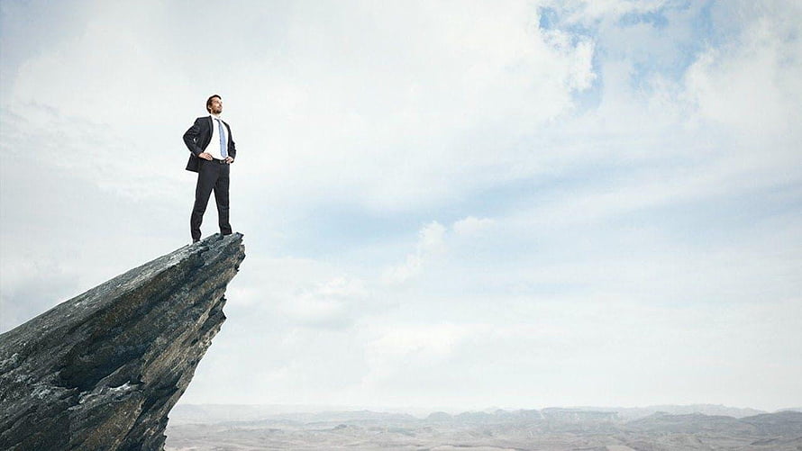 Businessman standing on a rocky cliff edge overlooking a vast landscape under a cloudy sky, Motivational and Inspirational Backgrounds Music For Videos, motivation background HD wallpaper