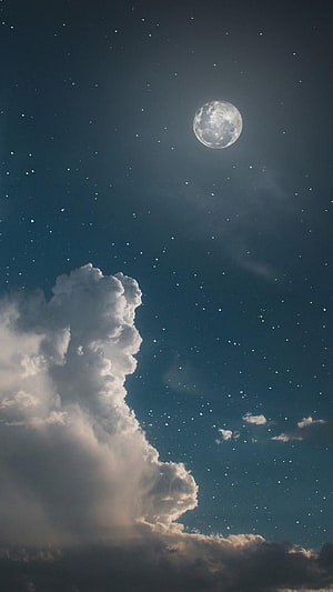 Full Moon Rising Over Towering Cumulus Clouds in a Starry Night Sky HD phone wallpaper