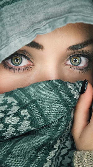 Close-up portrait of a woman with striking green eyes wearing a patterned green scarf and head covering, Beautiful Eyes Girl, graphy hijab girl eyes HD phone wallpaper
