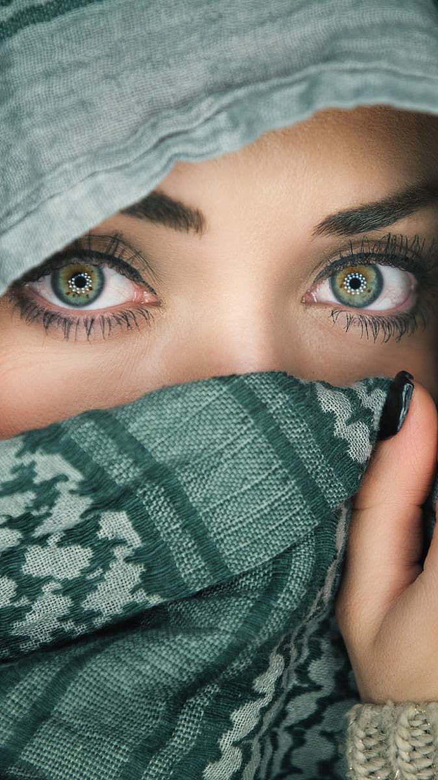 Close-up portrait of a woman with striking green eyes wearing a patterned green scarf and head covering, Beautiful Eyes Girl, graphy hijab girl eyes HD phone wallpaper