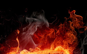 Dynamic Flames and Swirling Smoke Rising Against a Dark Background HD wallpaper