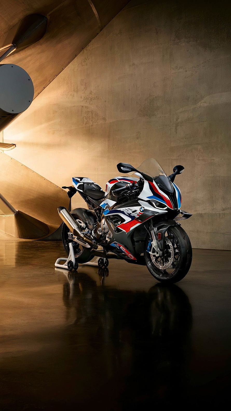 BMW M 1000 RR Superbike in M Motorsport Livery Parked in a Concrete Hangar HD phone wallpaper