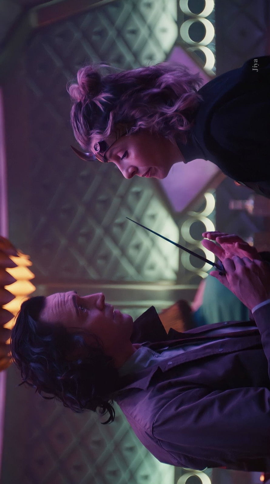 Loki and Sylvie in a Dramatic Confrontation Scene with Purple Lighting HD phone wallpaper