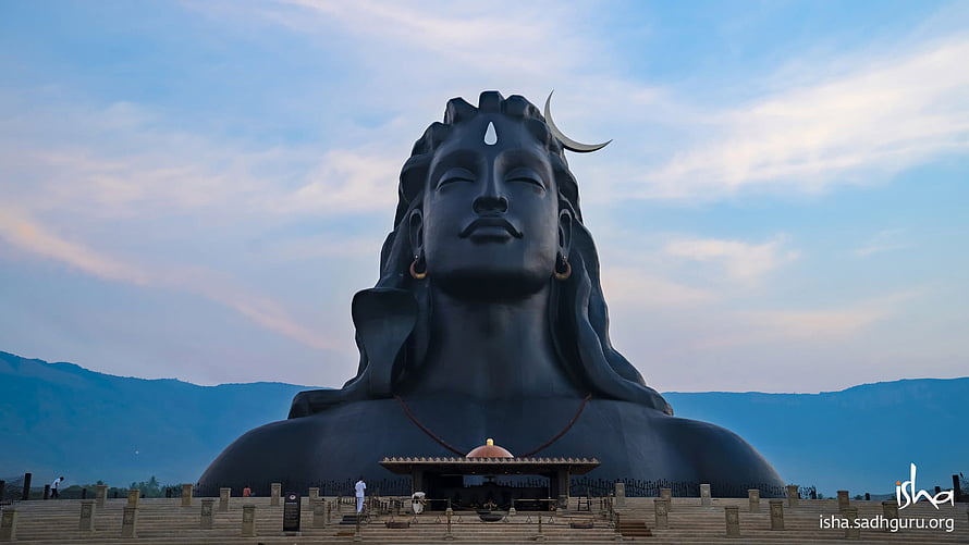 Adiyogi Statue at Isha Foundation with Serene Sky and Mountain Backdrop HD wallpaper