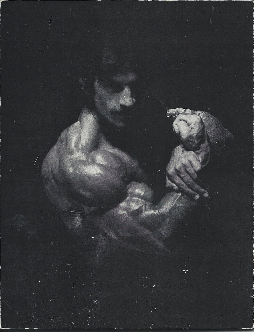 Vintage black and white photograph of a muscular man flexing his bicep in a dramatic pose, Heavy Duty, mike mentzer HD phone wallpaper