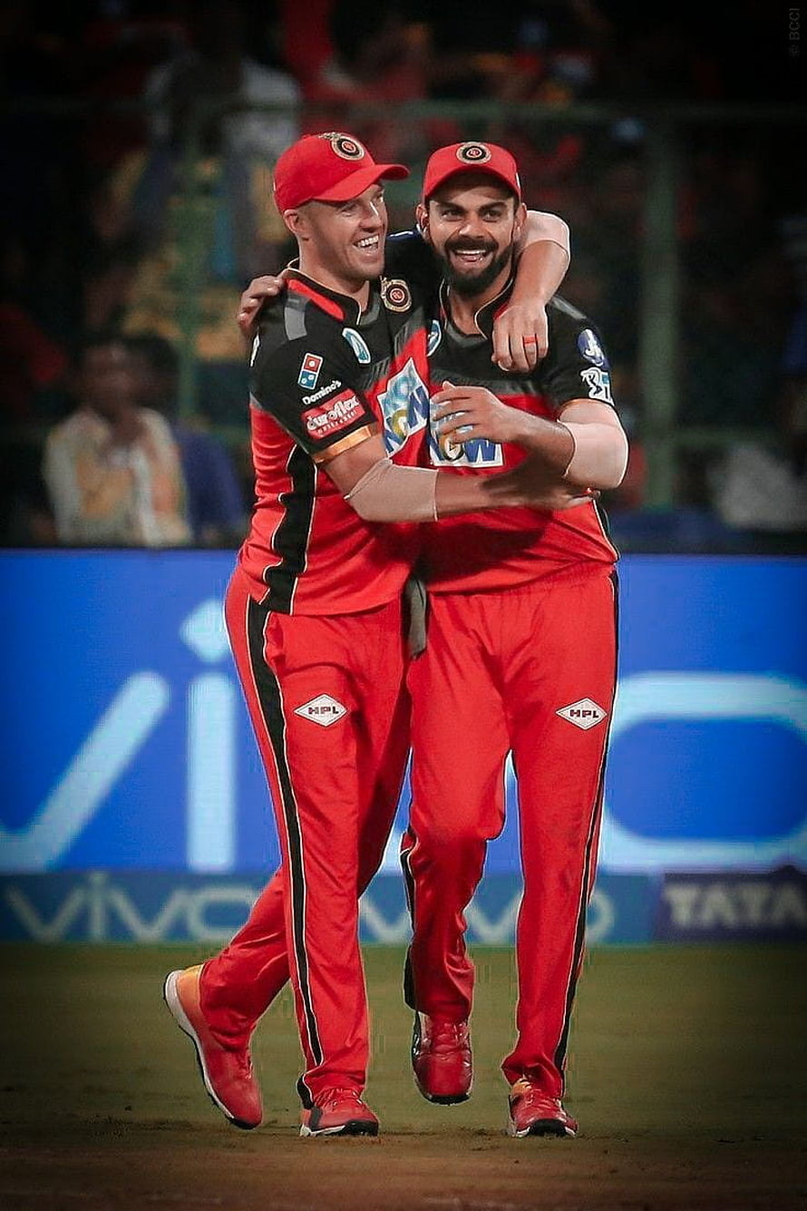 Rishabh Pant and Axar Patel Celebrating Together in Red RCB Cricket Jersey HD phone wallpaper
