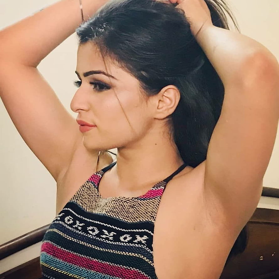 Young woman with dark hair in a colorful striped knit top posing with arms raised, Indians girls desi hairy ARMPITS and Underarms, indian women armpit HD phone wallpaper