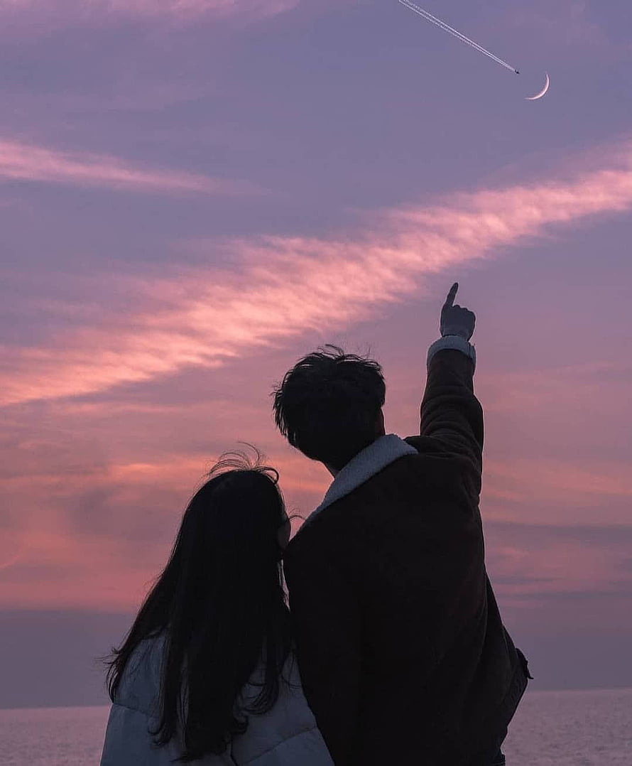 Couple Silhouette Pointing at Crescent Moon and Airplane Trail in Pink Sunset Sky HD phone wallpaper