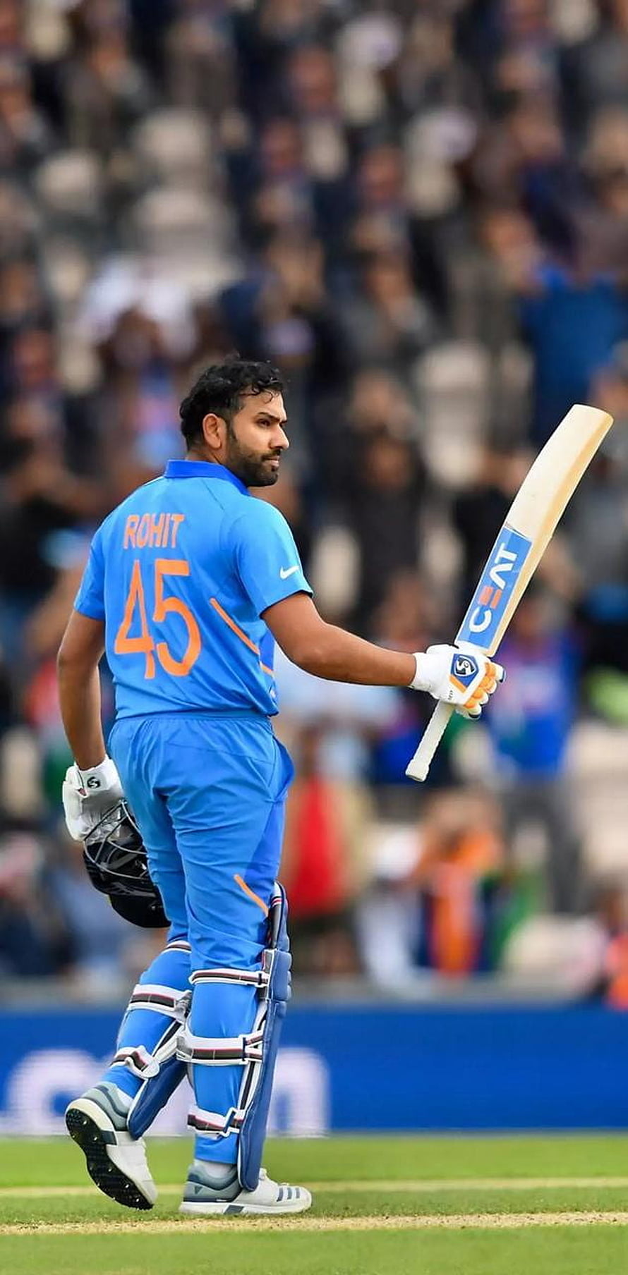 Rohit Sharma in Blue India Cricket Jersey Holding Bat on Field HD phone wallpaper