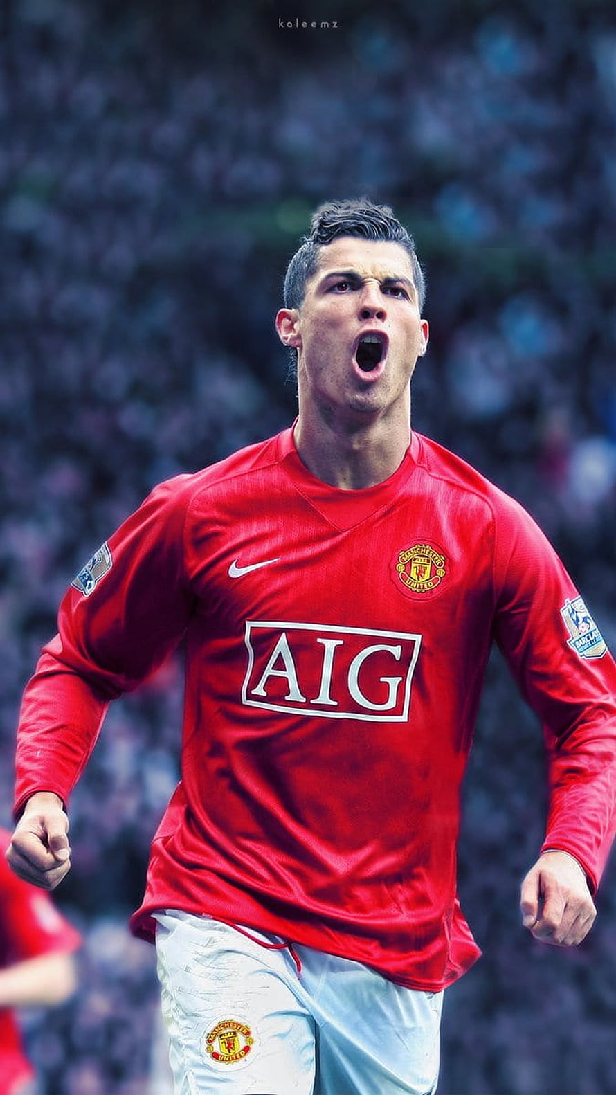 Cristiano Ronaldo in Manchester United Red Kit Celebrating on the Pitch HD phone wallpaper