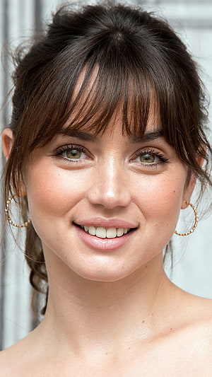 Anya Taylor-Joy Close-Up Portrait With Bangs And Gold Hoop Earrings HD phone wallpaper