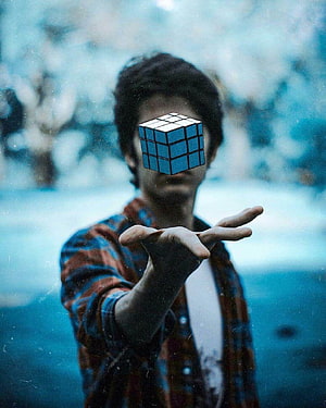 Young man holding a floating Rubik's cube over his face in a moody blue-toned outdoor scene, Stylish*] Boys Cool Profile Pics DP For Facebook & WhatsApp, cool anime whatsapp profile HD phone wallpaper