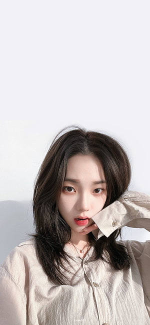 Portrait of a young woman with dark wavy hair wearing a beige button-down shirt against a white background, ْ on Twitter:, karina aespa HD phone wallpaper